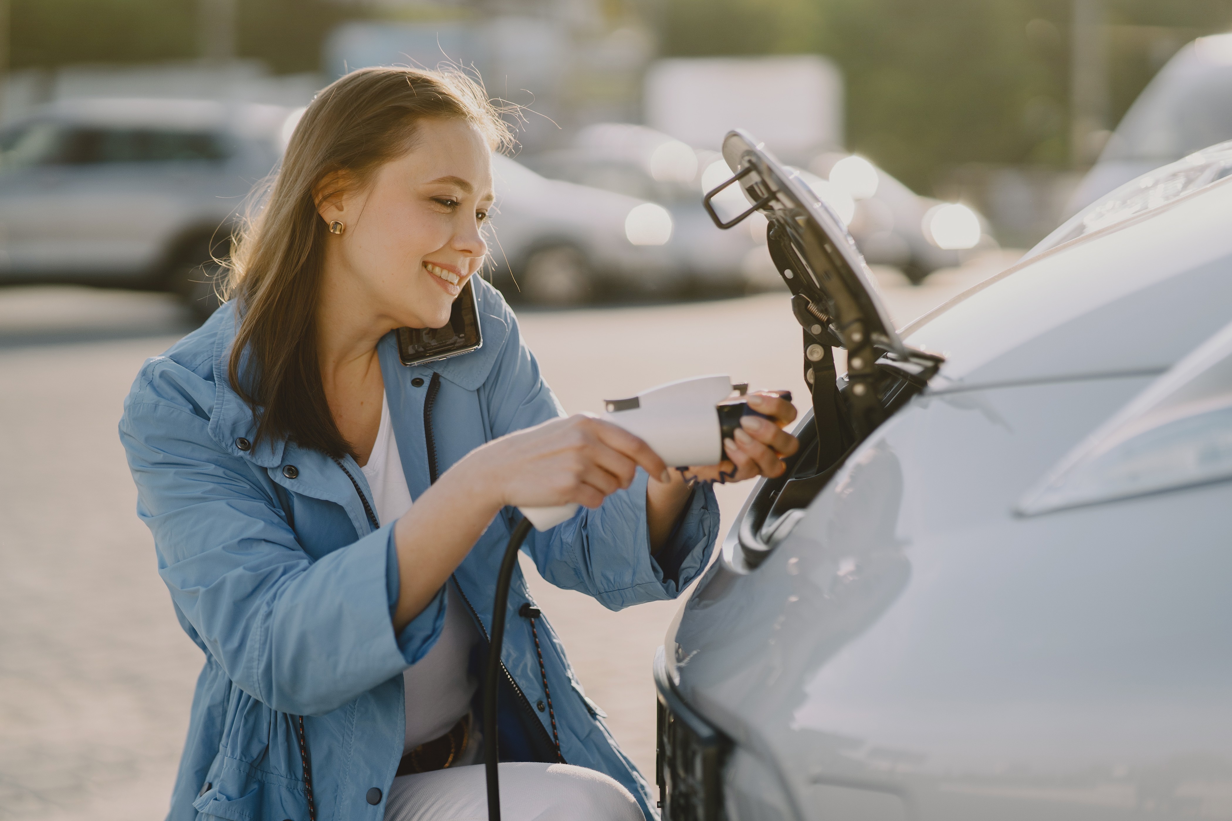 woman-charging-electro-car-electric-gas-station.jpg